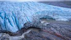 Aerial view of the Russell Glacier near Kangerlussuaq at sunset, front view the top of the glacier