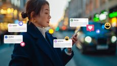 A woman scrolls through social media messages on her smartphone.