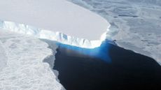 A view from above of a large glacier in the ocean