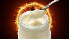 A jar of mayo in front of a burning sun